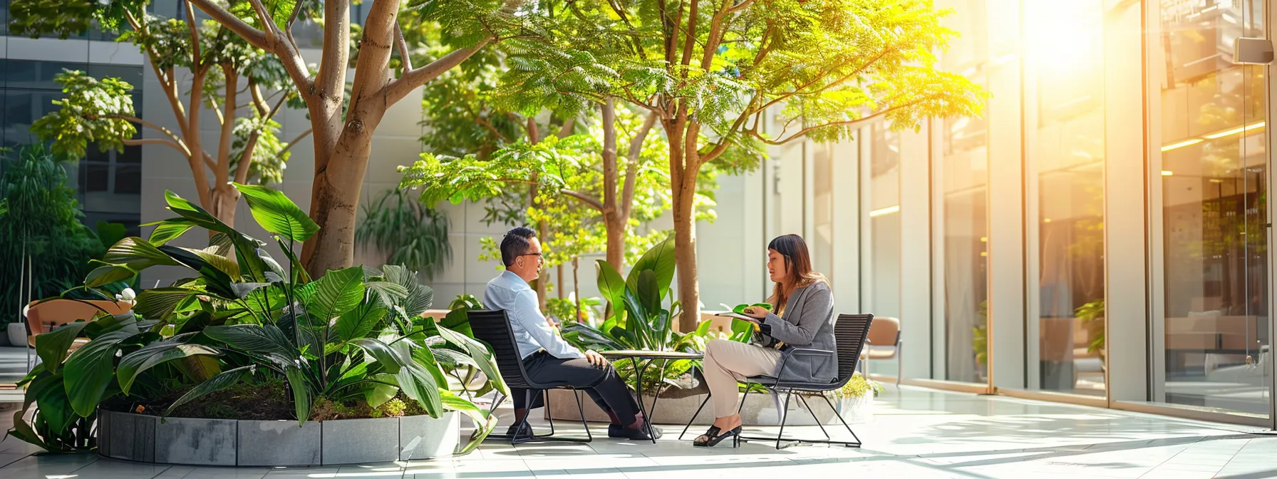 business professionals discussing the benefits of outdoor artificial trees.