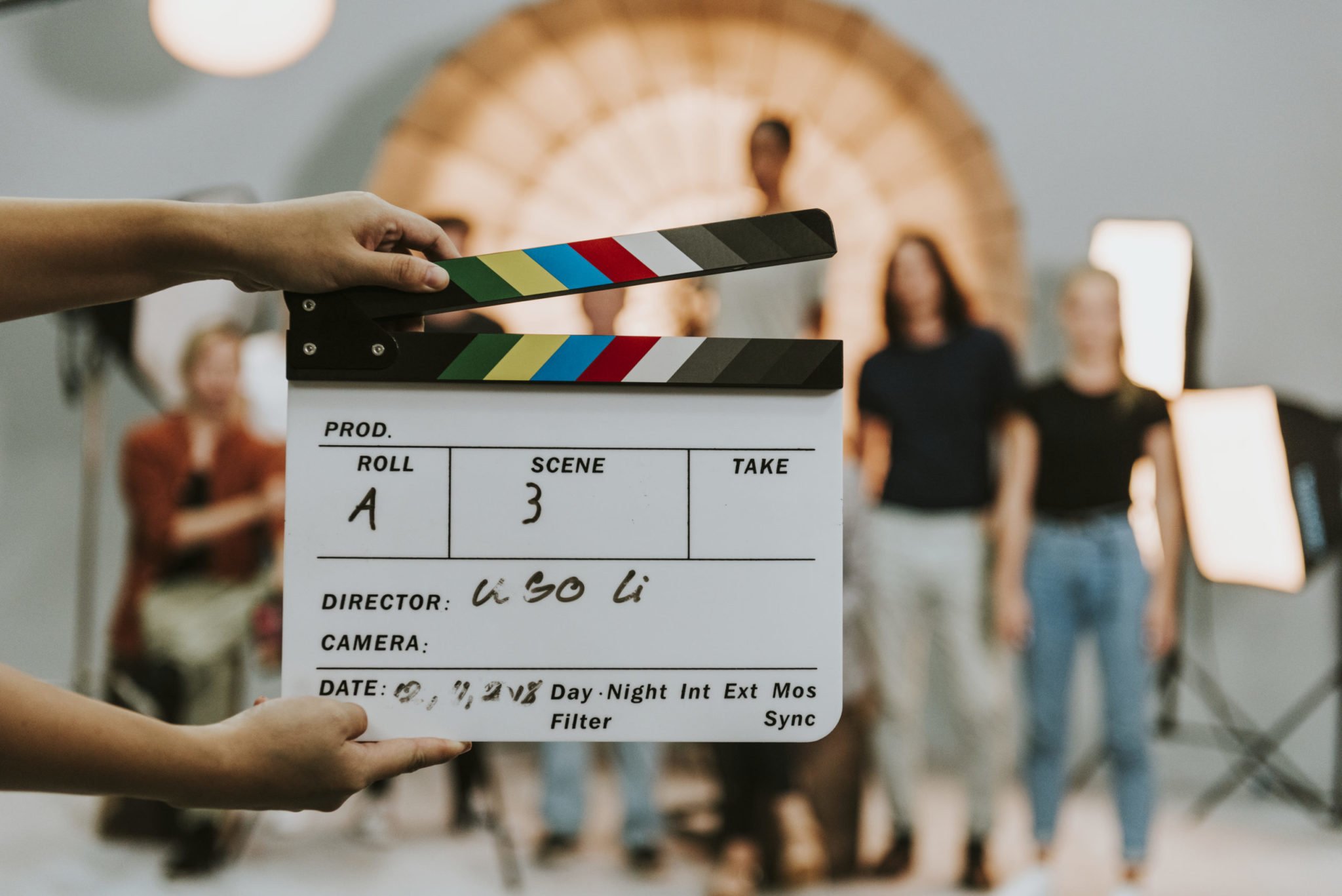 woman-holding-a-movie-production-clapperboard-2022-02-10-06-42-20-utc