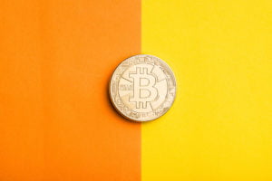 a coin on a yellow surface