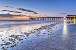 a long pier with snow